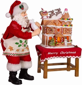 Kurt Adler 10.5-Inch Battery-Operated Fabriche Santa Decorating LED Gingerbread House Table Piece (JEL1203)